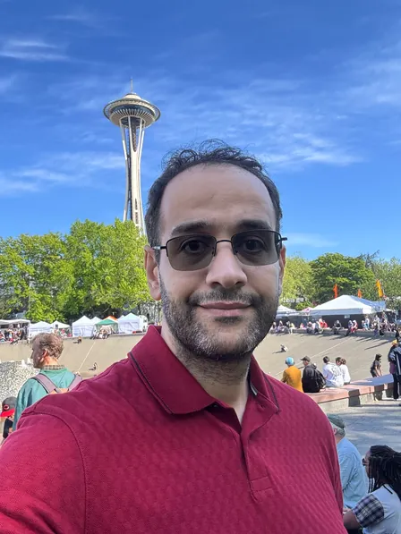 Mohamed Elsherif at Seattle Center, with the Space Needle behind him